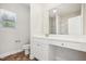 Well-lit bathroom with a vanity, toilet, and decorative mirror at 425 Legacy Dr, Youngsville, NC 27596