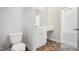 Bathroom with tiled floor, white fixtures, and vanity with mirror at 425 Legacy Dr, Youngsville, NC 27596