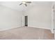 Bright bedroom with a ceiling fan, carpet, and a closet at 425 Legacy Dr, Youngsville, NC 27596