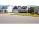 Attractive home with a two-car garage, lush lawn, and solar panels for energy efficiency at 425 Legacy Dr, Youngsville, NC 27596