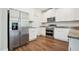 Kitchen featuring stainless steel appliances and crisp white cabinetry at 425 Legacy Dr, Youngsville, NC 27596