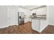 Kitchen with stainless steel refrigerator, white cabinets, and granite counters at 425 Legacy Dr, Youngsville, NC 27596