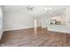 Bright and airy living room with laminate wood flooring and an open layout to kitchen at 425 Legacy Dr, Youngsville, NC 27596