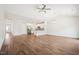 Open-concept living room with laminate wood flooring, recessed lighting and kitchen in background at 425 Legacy Dr, Youngsville, NC 27596