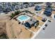 Aerial view of the community pool, clubhouse, playground, and parking lot at 4508 Brintons Cottage St, Raleigh, NC 27616