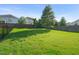 Spacious backyard with well-maintained lawn, mature trees, and secure fencing for privacy and safety at 4508 Brintons Cottage St, Raleigh, NC 27616