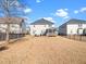 A backyard area shows grass, fence, patio, seating area, and trees at 4508 Brintons Cottage St, Raleigh, NC 27616