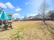 A backyard area shows grass, fence, patio, seating area, and trees at 4508 Brintons Cottage St, Raleigh, NC 27616