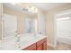 Bathroom featuring double sinks, cabinets, and bathtub in the background at 4508 Brintons Cottage St, Raleigh, NC 27616