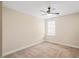 Neutral bedroom featuring a carpeted floor, beige walls, and a ceiling fan at 4508 Brintons Cottage St, Raleigh, NC 27616