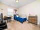 This bedroom has a single bed, dresser, tv, desk, and decor at 4508 Brintons Cottage St, Raleigh, NC 27616