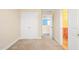 Cozy bedroom with neutral walls, carpeted floor, and a view of an adjacent room at 4508 Brintons Cottage St, Raleigh, NC 27616
