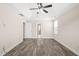 Neutral bedroom with tray ceilings, a ceiling fan, and natural light from the window at 4508 Brintons Cottage St, Raleigh, NC 27616