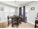 Cozy dining area with backyard access and lots of light coming through the windows at 4508 Brintons Cottage St, Raleigh, NC 27616