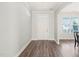 Clean and bright entryway boasting hardwood floors and a glimpse of the adjacent dining area at 4508 Brintons Cottage St, Raleigh, NC 27616