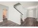 Welcoming entryway features sleek hardwood floors and staircase leading to the upper level at 4508 Brintons Cottage St, Raleigh, NC 27616