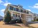 A two story home exterior elevation shows lawn, shrubbery, porch, and garage at 4508 Brintons Cottage St, Raleigh, NC 27616