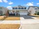 Charming two-story home featuring a covered porch, attached garage, and manicured landscaping at 4508 Brintons Cottage St, Raleigh, NC 27616