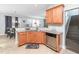 Open kitchen view with granite counters, stainless appliances and easy access to dining and living room at 4508 Brintons Cottage St, Raleigh, NC 27616