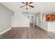 Spacious open-concept living area with hardwood floors, flowing into the kitchen and entryway at 4508 Brintons Cottage St, Raleigh, NC 27616