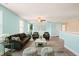 Spacious living room with ample seating, light-blue walls, and decorative accents at 4508 Brintons Cottage St, Raleigh, NC 27616