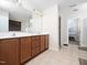 Spacious main bathroom vanity area with and sink areas, tiled flooring and modern lighting at 4508 Brintons Cottage St, Raleigh, NC 27616