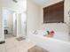 Relaxing bathroom features a tub, and a separate shower with a glass door at 4508 Brintons Cottage St, Raleigh, NC 27616