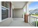 Side porch with gray siding and brick at 4508 Brintons Cottage St, Raleigh, NC 27616