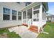 Exterior view of a screened-in porch leading to the yard at 4508 Brintons Cottage St, Raleigh, NC 27616