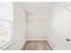 Walk-in closet featuring carpeted floors, shelving, and natural light from a bright window at 4508 Brintons Cottage St, Raleigh, NC 27616