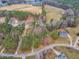 Aerial view of neighborhood featuring mature trees and large lots at 5661 Quail Covey Ln, Wendell, NC 27591