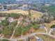 Aerial view of neighborhood featuring mature trees and large lots at 5661 Quail Covey Ln, Wendell, NC 27591
