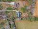 Aerial view of home showing wooded lot and surrounding acreage at 5661 Quail Covey Ln, Wendell, NC 27591