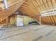 Large unfinished attic space ready for customization with exposed rafters and a doorway at 5661 Quail Covey Ln, Wendell, NC 27591