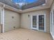Inviting backyard wooden deck with double doors and windows, perfect for outdoor relaxing at 5661 Quail Covey Ln, Wendell, NC 27591