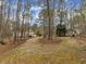View of the large backyard showing storage shed and home at 5661 Quail Covey Ln, Wendell, NC 27591