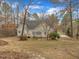 Charming home with a back deck surrounded by tall trees and a spacious yard at 5661 Quail Covey Ln, Wendell, NC 27591