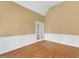 Bright bedroom features hardwood floors, wainscoting and glass panel doors at 5661 Quail Covey Ln, Wendell, NC 27591