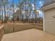 View of the wood deck overlooking the wooded backyard of the home at 5661 Quail Covey Ln, Wendell, NC 27591