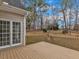 View of the wood deck and backyard with walkout access from the home at 5661 Quail Covey Ln, Wendell, NC 27591