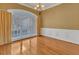 Elegant dining room features hardwood floors, wainscoting, and a large window at 5661 Quail Covey Ln, Wendell, NC 27591