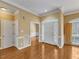 Bright foyer boasts hardwood floors, transom window, and arched doorway at 5661 Quail Covey Ln, Wendell, NC 27591