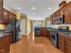 Kitchen with stainless steel appliances, eat-in bar and view to the dining room at 5661 Quail Covey Ln, Wendell, NC 27591