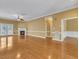 Open-concept living room with fireplace and patio access at 5661 Quail Covey Ln, Wendell, NC 27591