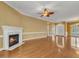 Open living room with fireplace, hardwood floors and natural lighting at 5661 Quail Covey Ln, Wendell, NC 27591