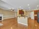 Open-concept living room with fireplace and view to the eat-in kitchen at 5661 Quail Covey Ln, Wendell, NC 27591