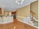 Open-concept living room with beautiful hardwood floors and a staircase at 5661 Quail Covey Ln, Wendell, NC 27591