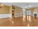 Spacious living room with hardwood floors, fireplace, and natural light at 5661 Quail Covey Ln, Wendell, NC 27591