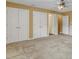 Large room with neutral carpet and walls with multiple doors for easy access at 5661 Quail Covey Ln, Wendell, NC 27591