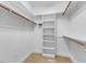 Walk-in closet with custom shelving and a hanging rod maximizes storage space at 5661 Quail Covey Ln, Wendell, NC 27591